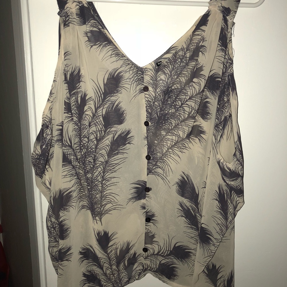 Sheer sleeveless top.
